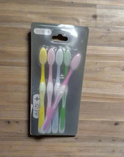 Pack of toothbrushes with visible brand name on a dark background