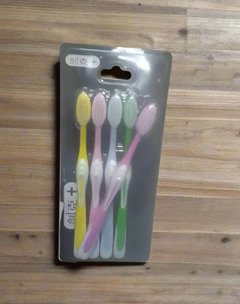 Pack of toothbrushes with visible brand name on a dark background
