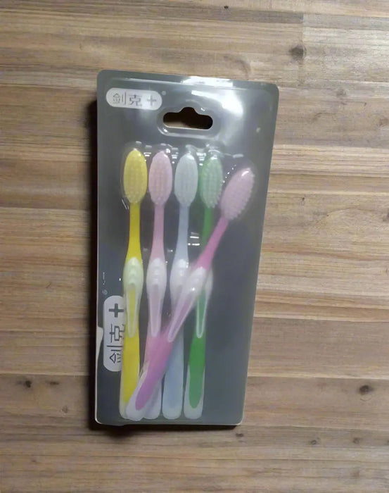 Pack of toothbrushes with visible brand name on a dark background