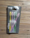 Pack of toothbrushes with visible brand name on a dark background