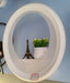 A circular, white wall shelf, shaped like a hollow ring Murukali.com