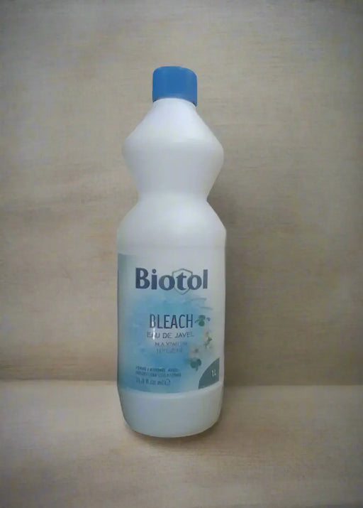 Biotol bleach bottle held by a hand in a store setting