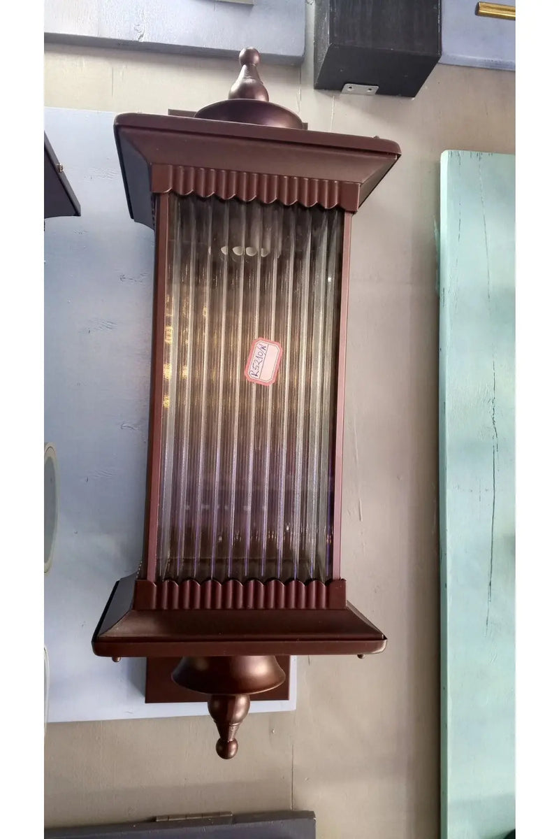 Bronze-colored, rectangular wall sconce. Murukali.com