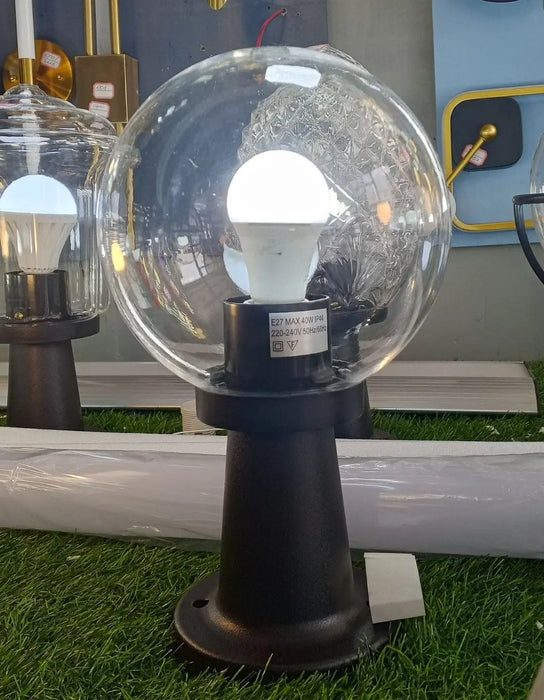 Cone-shaped outdoor lamp post with a clear glass sphere globe. Murukali.com