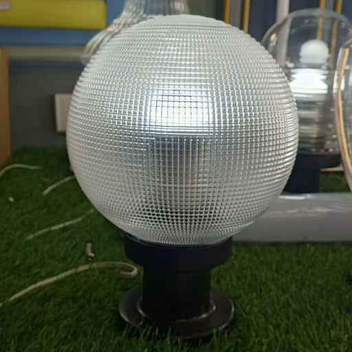 Globe-shaped outdoor lamp on a black metal base Murukali.com