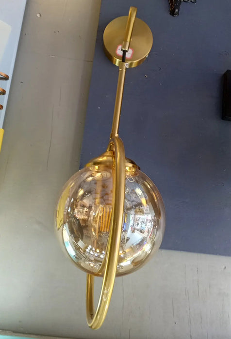 Gold-colored wall-mounted light fixture Murukali.com