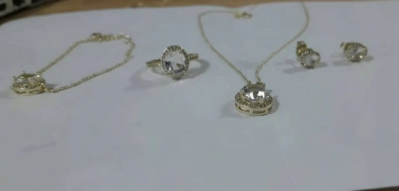 Jewelry set including transparent stone rings and necklaces, earrings and a handlace