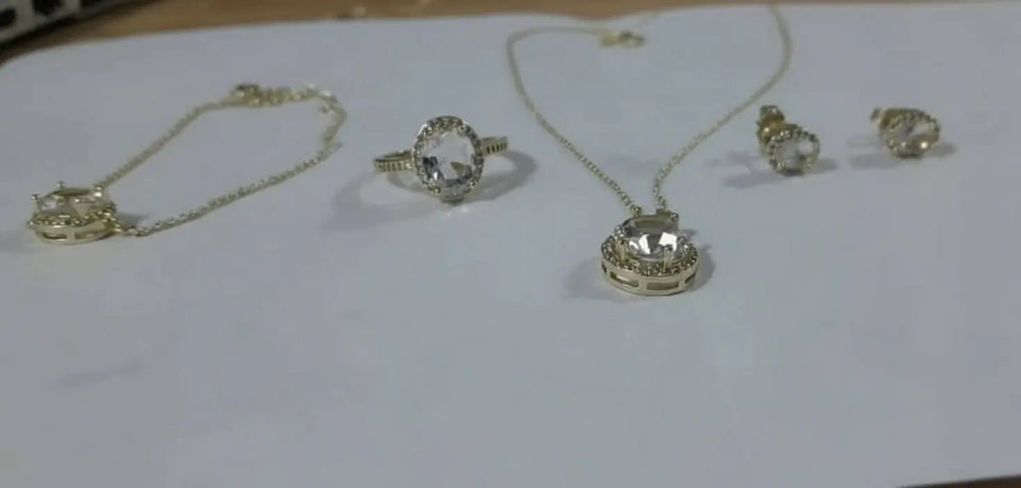 Jewelry set including transparent stone rings and necklaces, earrings and a handlace