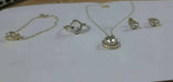 Jewelry set including transparent stone rings and necklaces, earrings and a handlace