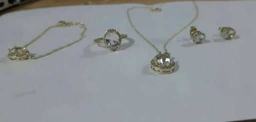 Jewelry set including transparent stone rings and necklaces, earrings and a handlace