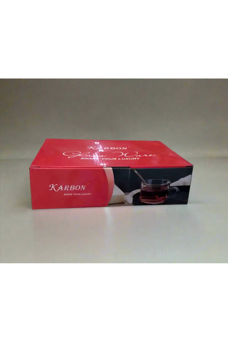 Red Karbon box held by a person on a tiled floor