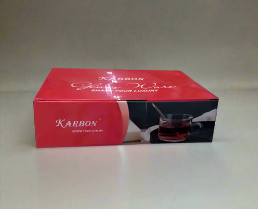 Red Karbon box held by a person on a tiled floor