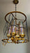 Luxury Gold and Glass Chandelier with Intricate Black Metal Design murukali.com