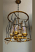 Luxury Gold and Glass Chandelier with Intricate Black Metal Design murukali.com