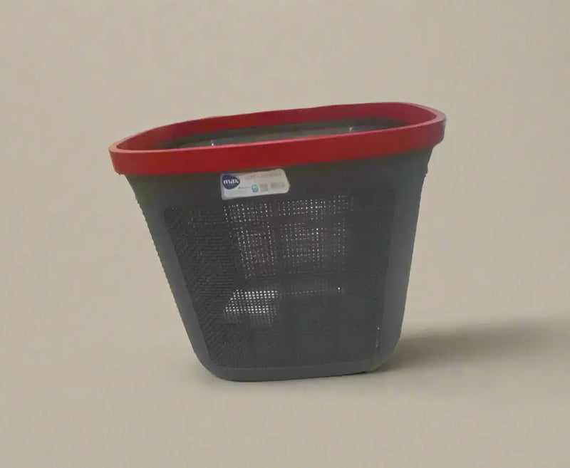 Black laundry basket with a red rim on a tiled floor