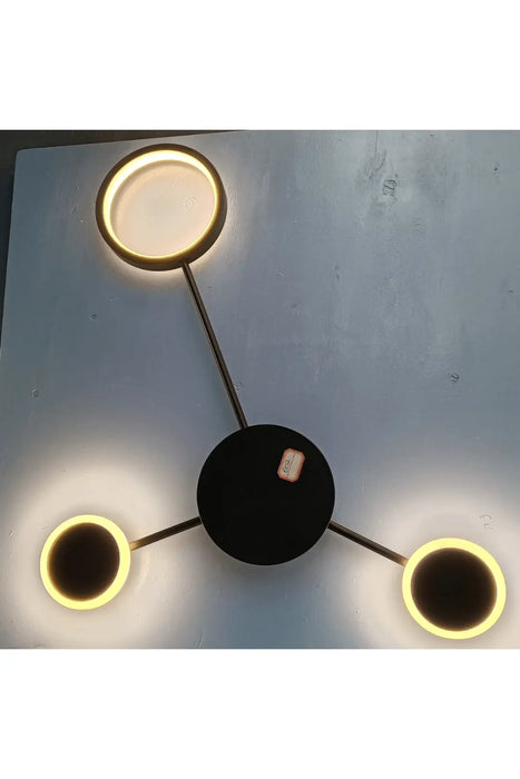 Modern Wall-Mounted LED Light Fixture – Sleek Triple Circular Design with Warm White Glow murukali.com