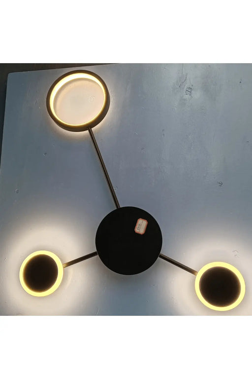 Modern Wall-Mounted LED Light Fixture – Sleek Triple Circular Design with Warm White Glow murukali.com
