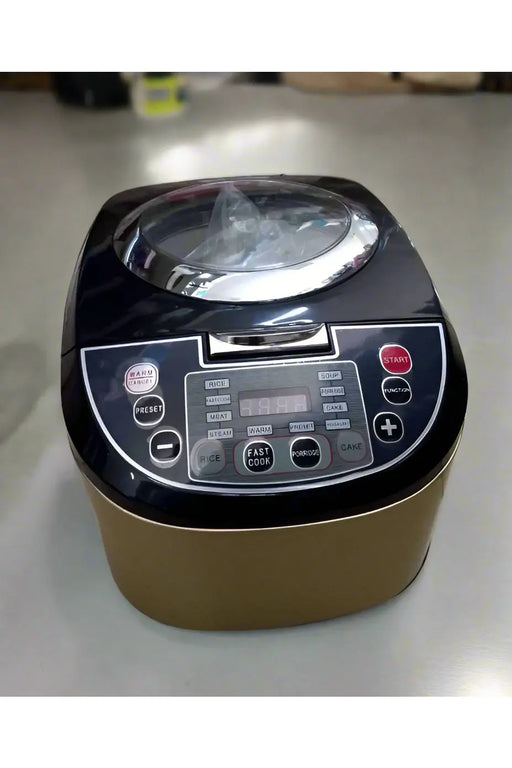 Black and gold rice cooker on a store shelf with packaging in the background
