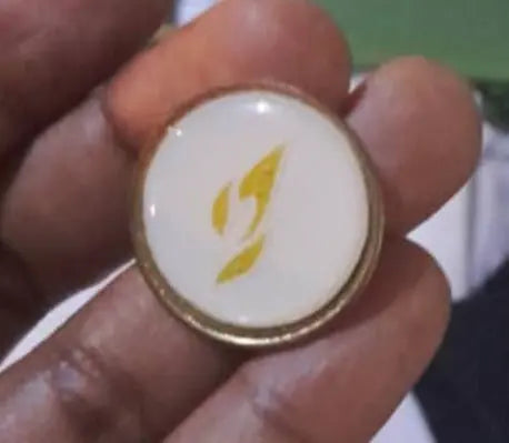 Pin or Badge with Stylized Yellow Rocket Murukali.com