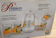 Box of Premiere glassware set held by a person in a store.