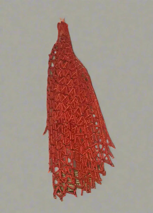 Red woven bag on a white surface