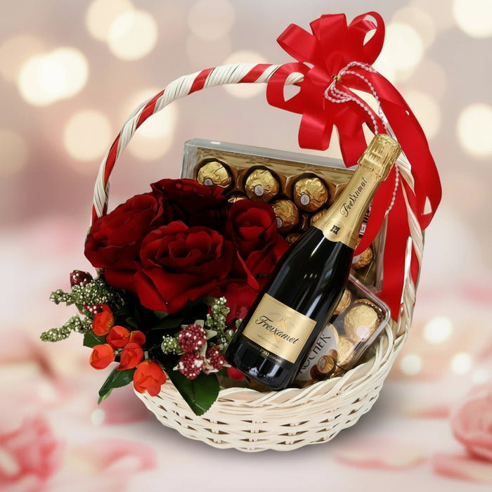 Gift basket with artificial blooms, chocolates, and a bottle of champagne