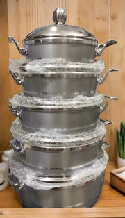 Stacked Aluminum Cooking Pot Set on Display Shelf Murukali.com