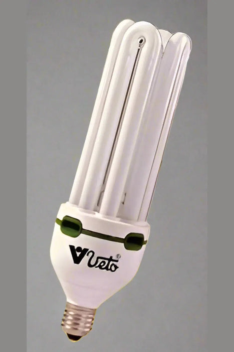 Hand holding a packaged light bulb in a store setting