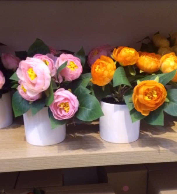 Decorative Artificial Flowers in White Pots