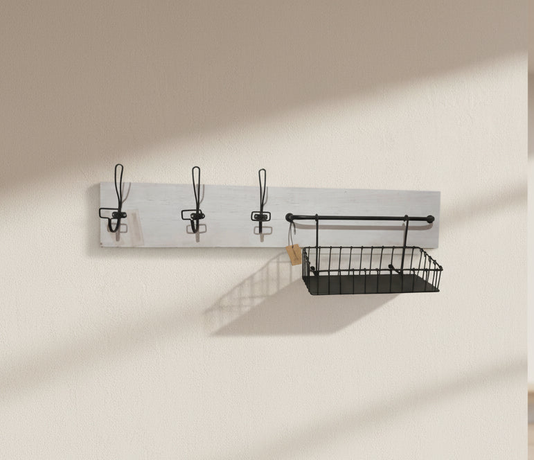 Wall-mounted coat rack with hooks and a small shelf