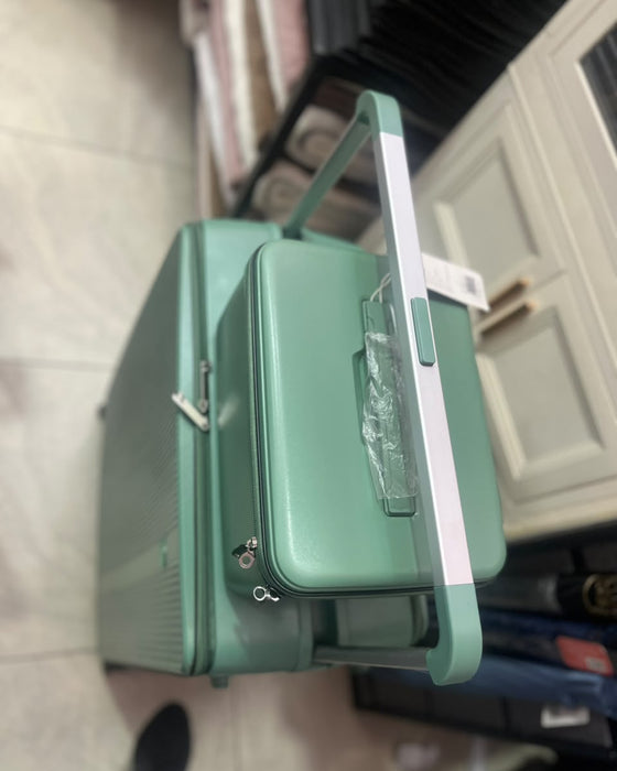 A Mint Green Hardshell Spinner Suitcase With Matching Zippered Storage Bag Large