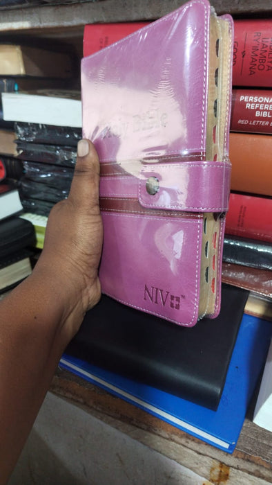 NIV Holy Bible pink snap-button strap closure cover