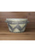 Handheld woven basket with a checkered pattern in a casual setting
