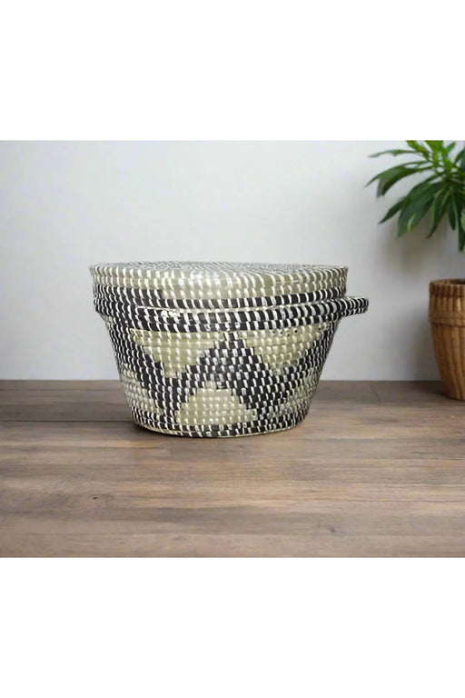 Handheld woven basket with a lid in a store setting